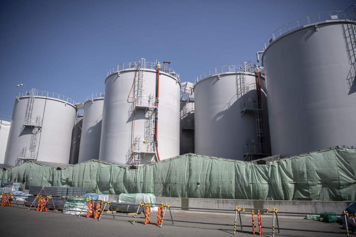 This picture taken on March 5, 2022 shows storage tanks for treated contaminated water at the Tokyo Electric Power Company (TEPCO) Fukushima Dai-ichi nuclear power plant in Okuma, Fukushima prefecture